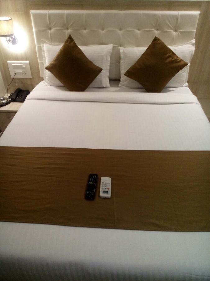 Hotel Grace Inn Mumbai Szoba fotó